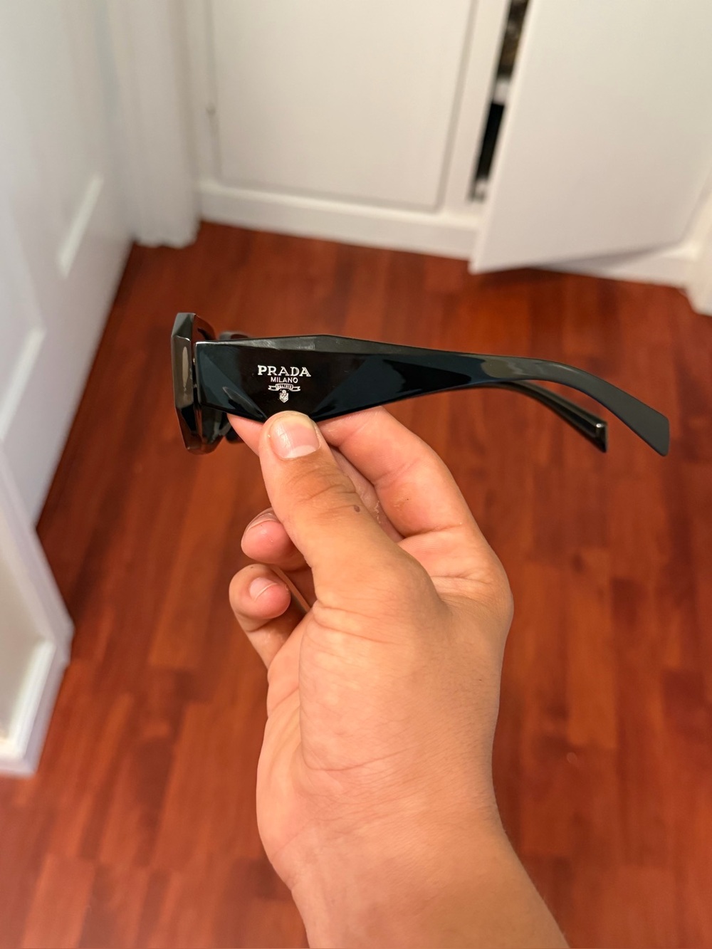 Prada Black Gloss women’s
Sunglasses with Logo Detail